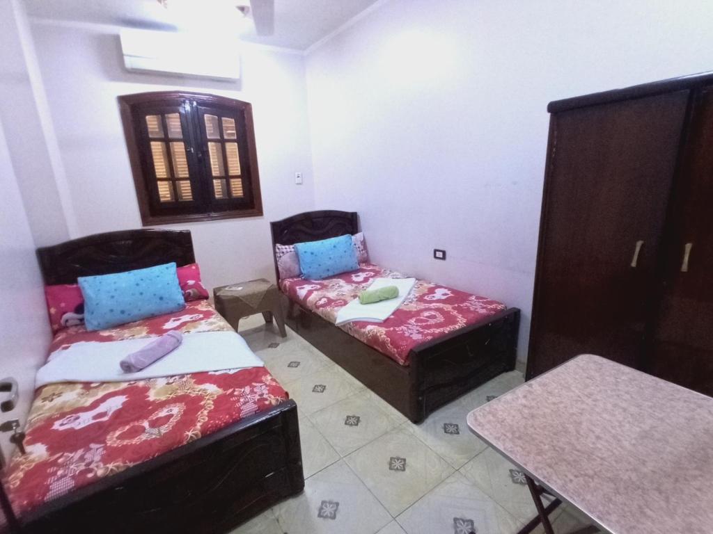 Postel nebo postele na pokoji v ubytování Aswan City Center Guest House