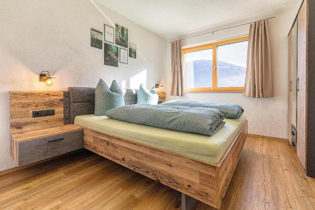 Postel nebo postele na pokoji v ubytování Appart Zellblick