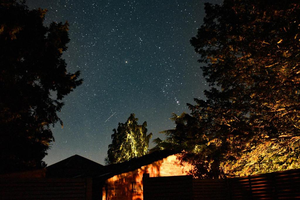 a starry night with a building in the background at The Old Coach House at Stewton in Louth
