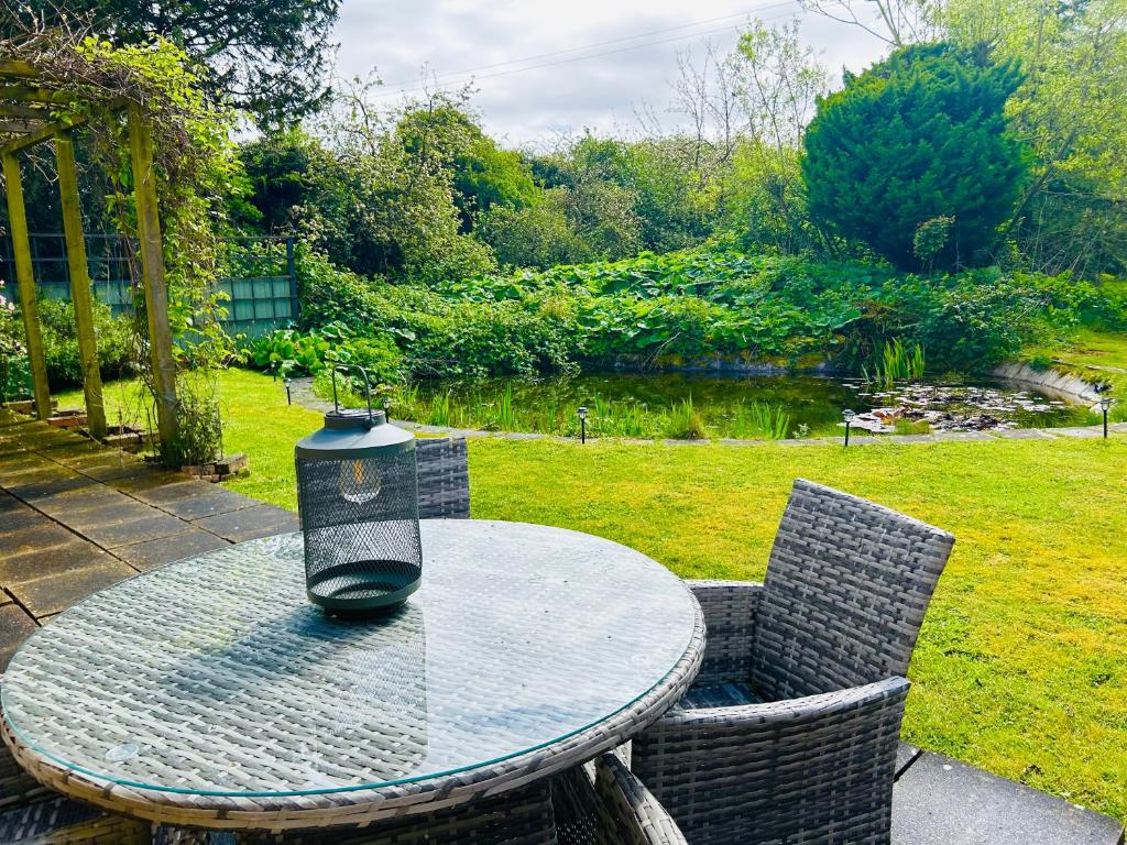 a table with a candle sitting on top of it at The Old Coach House at Stewton in Louth