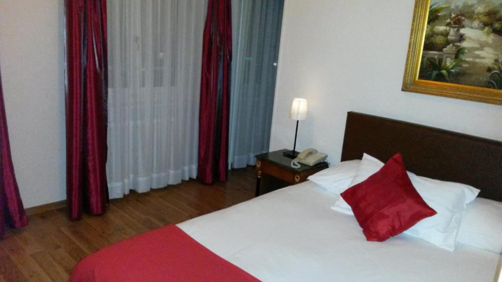 Postel nebo postele na pokoji v ubytování Hotel Century