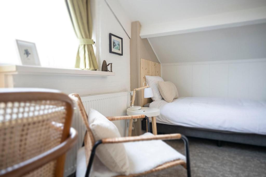Llit o llits en una habitació de B&B De Dream