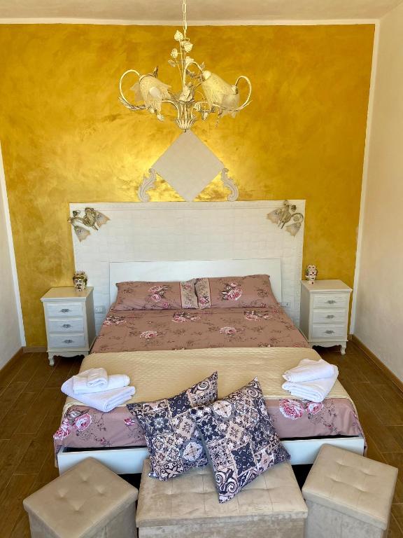 a bedroom with a bed and a ceiling at MareSol in Marsala