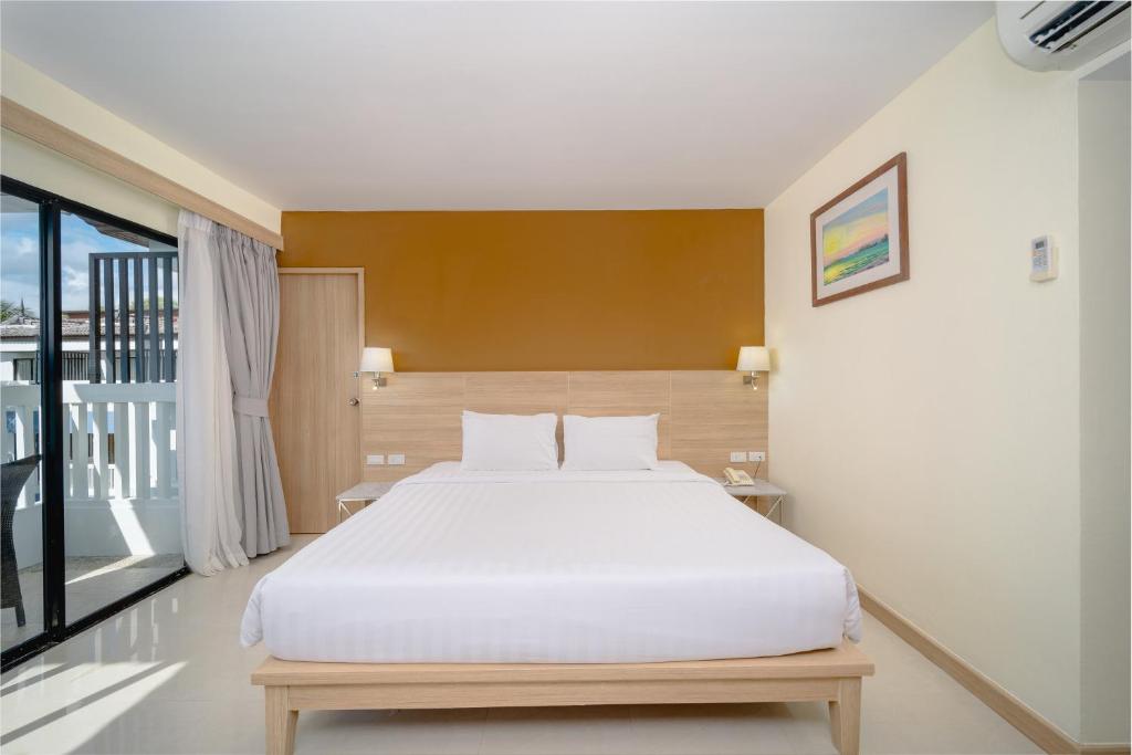 Postel nebo postele na pokoji v ubytování Aonang Buri Resort