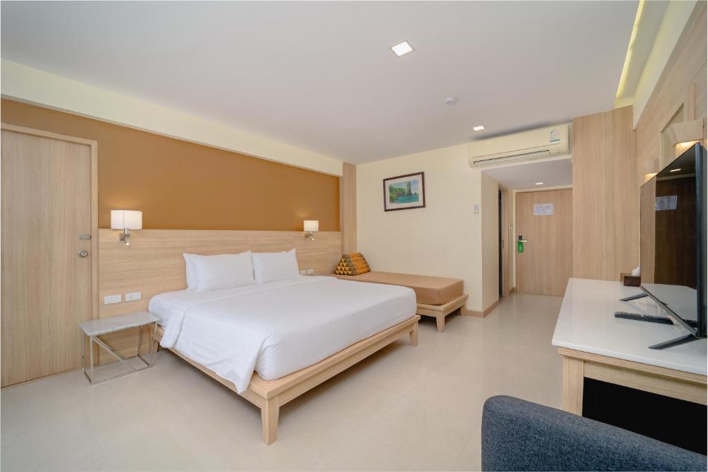 Postel nebo postele na pokoji v ubytování Aonang Buri Resort