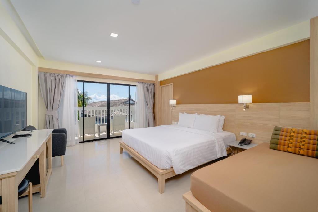 Postel nebo postele na pokoji v ubytování Aonang Buri Resort