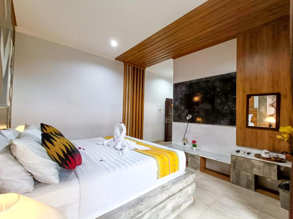 Postel nebo postele na pokoji v ubytování Wisata Bintang Hotel