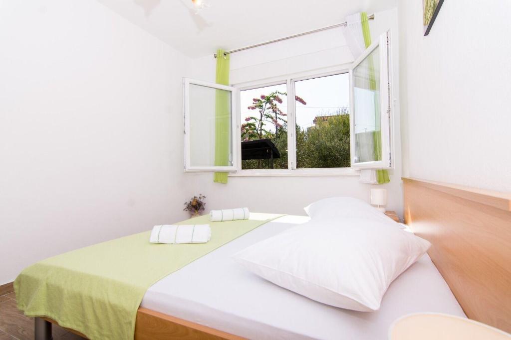 Ένα ή περισσότερα κρεβάτια σε δωμάτιο στο Apartment Ivica