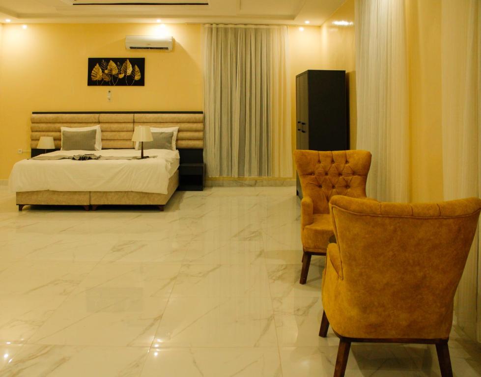 Postel nebo postele na pokoji v ubytování Urban Hotel Suites