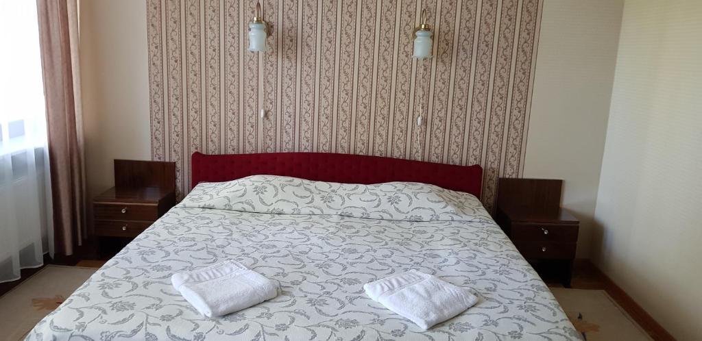 Postel nebo postele na pokoji v ubytování Narva-Jõesuu Beach Residence
