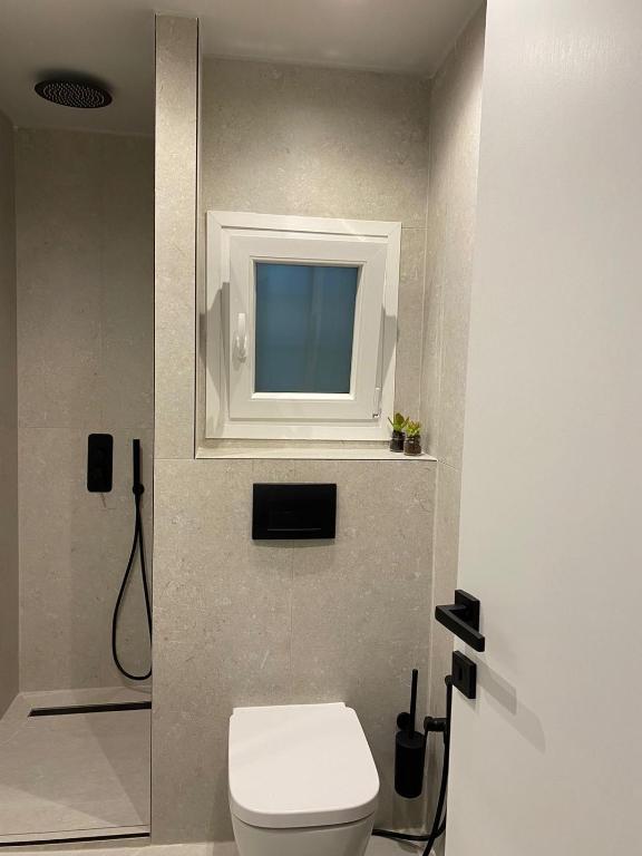 Koupelna v ubytování SimOtel Downtown Suite