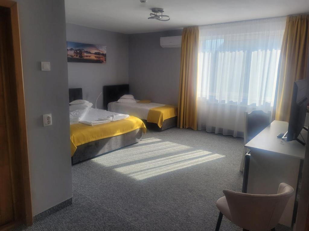 Postel nebo postele na pokoji v ubytování Hotel Delaf