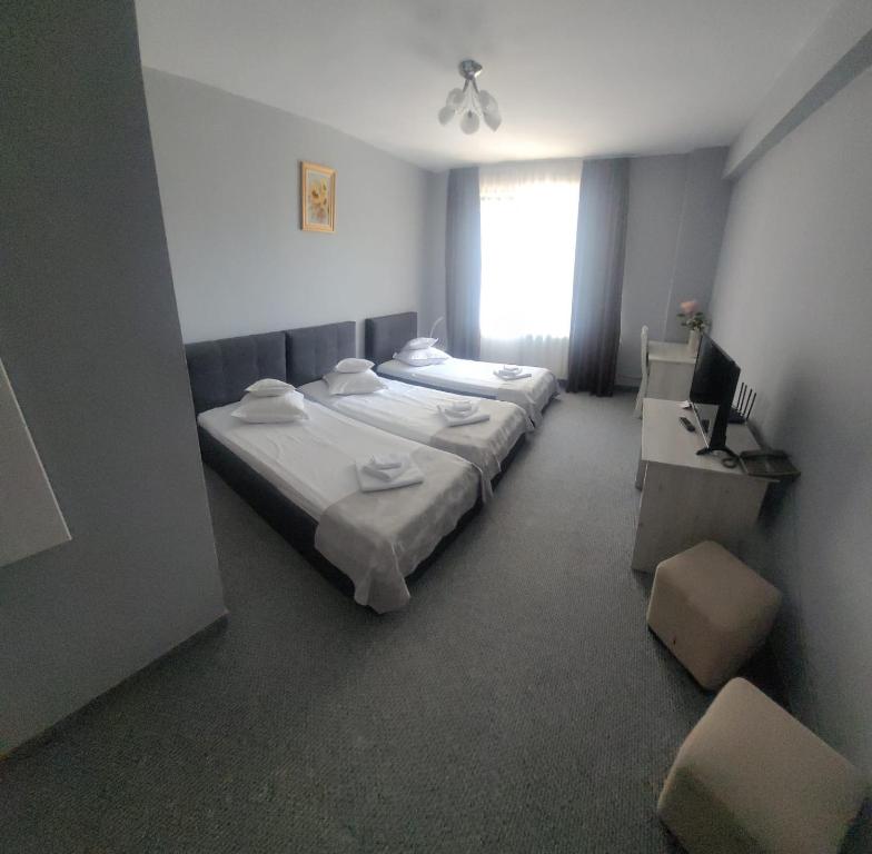 Postel nebo postele na pokoji v ubytování Hotel Delaf