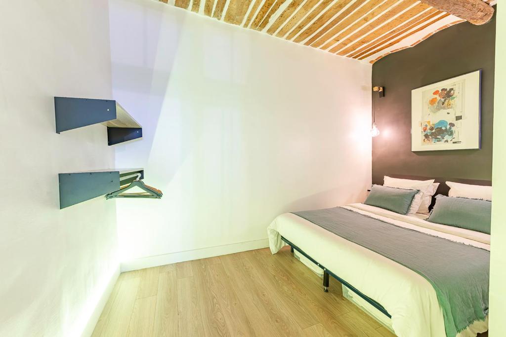 Posteľ alebo postele v izbe v ubytovaní Belle rénovation moderne au coeur du Panier