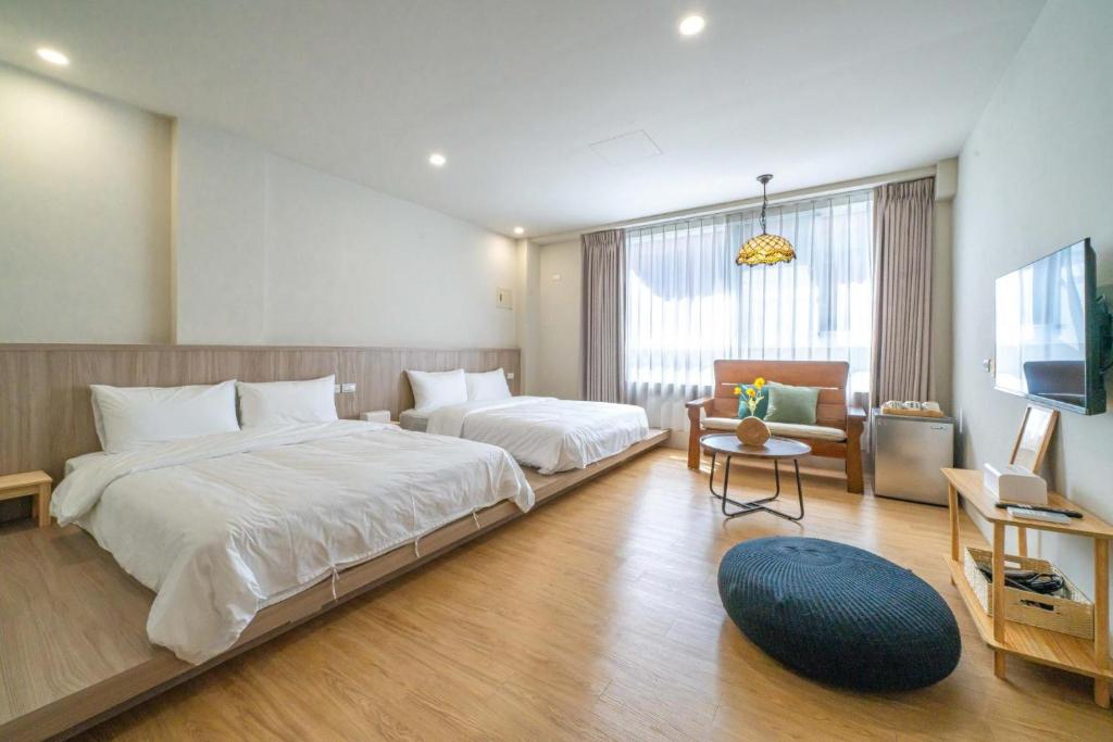 Ένα ή περισσότερα κρεβάτια σε δωμάτιο στο Nantuju