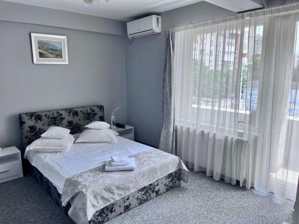 Postel nebo postele na pokoji v ubytování Hotel Delaf