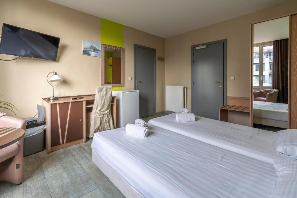 Postel nebo postele na pokoji v ubytování Sleep & Go Blankenberge