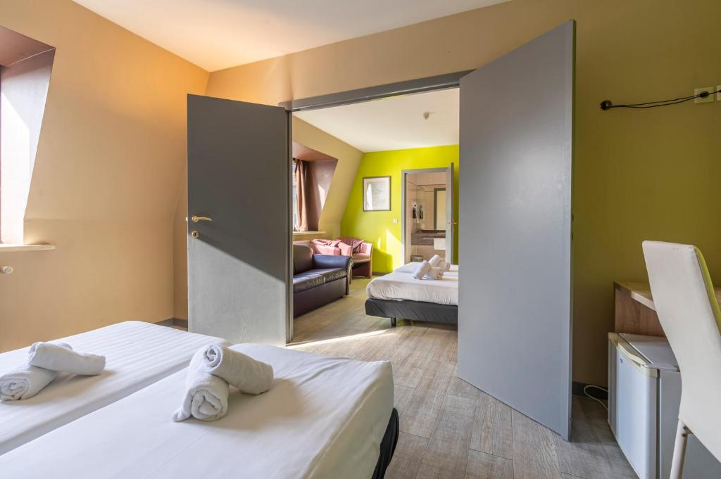 Postel nebo postele na pokoji v ubytování Sleep & Go Blankenberge