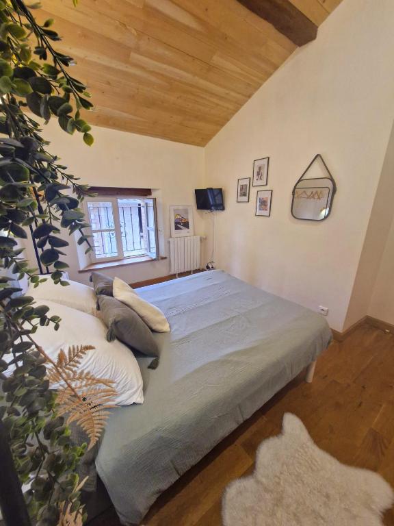 Postel nebo postele na pokoji v ubytování chambres d'hotes Le 1891