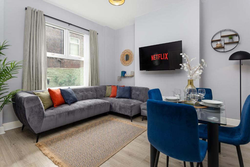a living room with a couch and a table at Arkles House - Air Host & Stay - Anfield in Liverpool