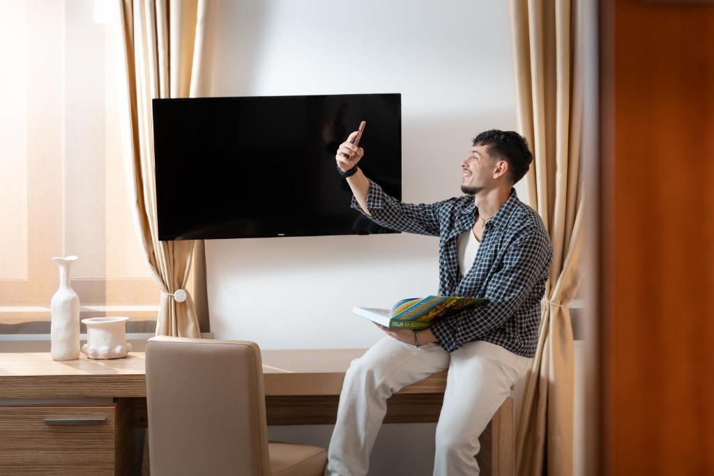 TV a/nebo společenská místnost v ubytování Garden Area Roma Eur