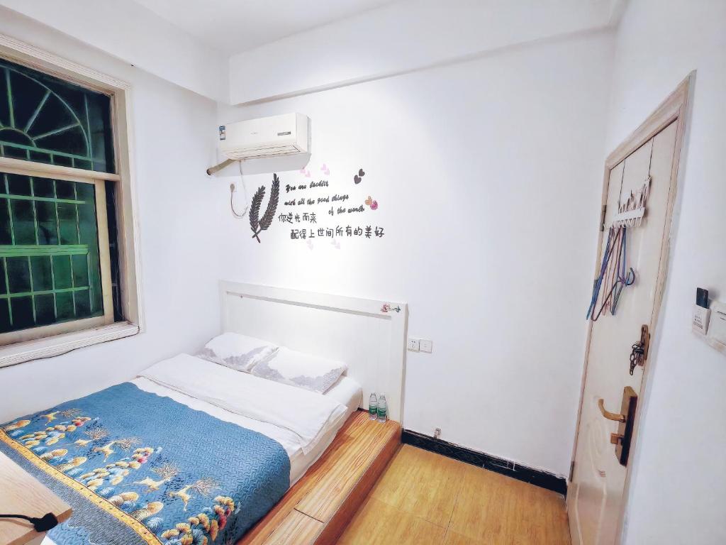 Postel nebo postele na pokoji v ubytování Lumingju Homestay