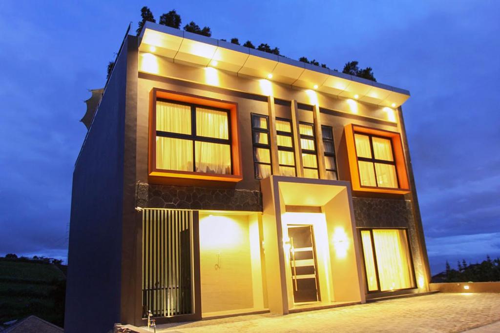 a large building with lights on it at night at Daily Home Villa Dago in Bandung