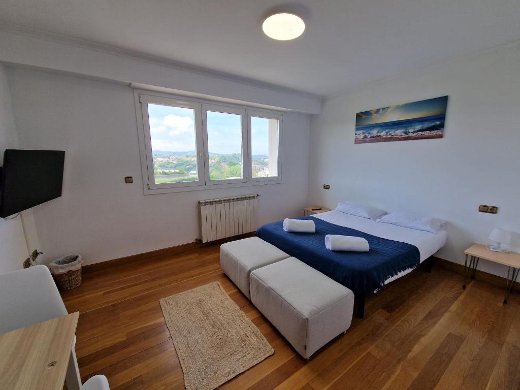 Postel nebo postele na pokoji v ubytování Pensión Aussie II