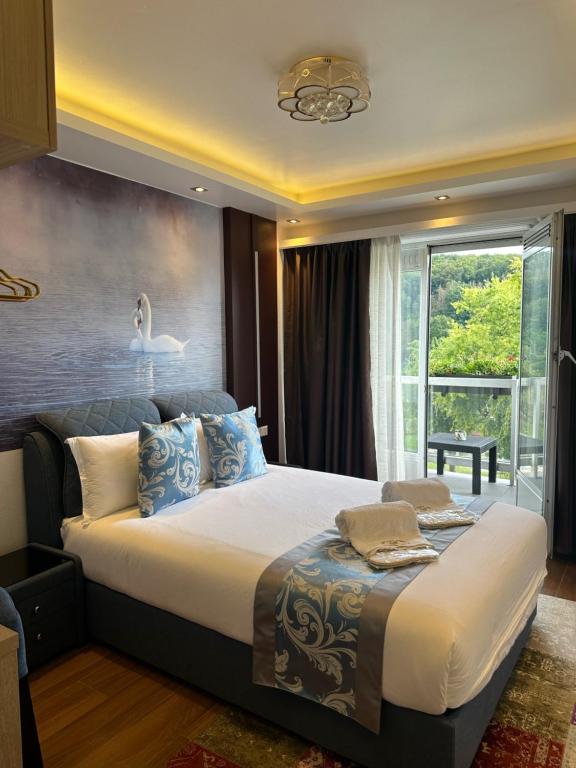 Postel nebo postele na pokoji v ubytování hotel whiteswan