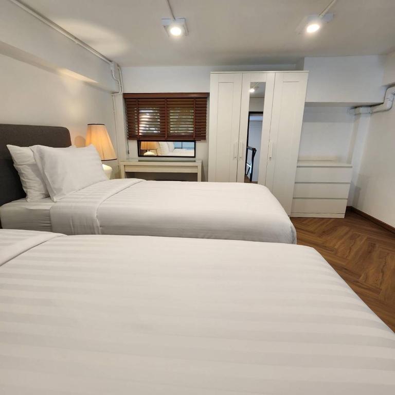 Cama ou camas em um quarto em Sleep Walker Poshtel