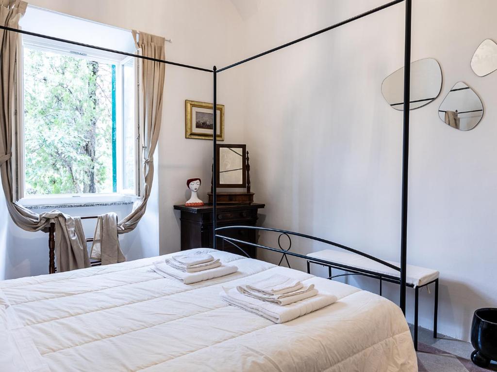 Łóżko lub łóżka w pokoju w obiekcie Domus Lago Rome