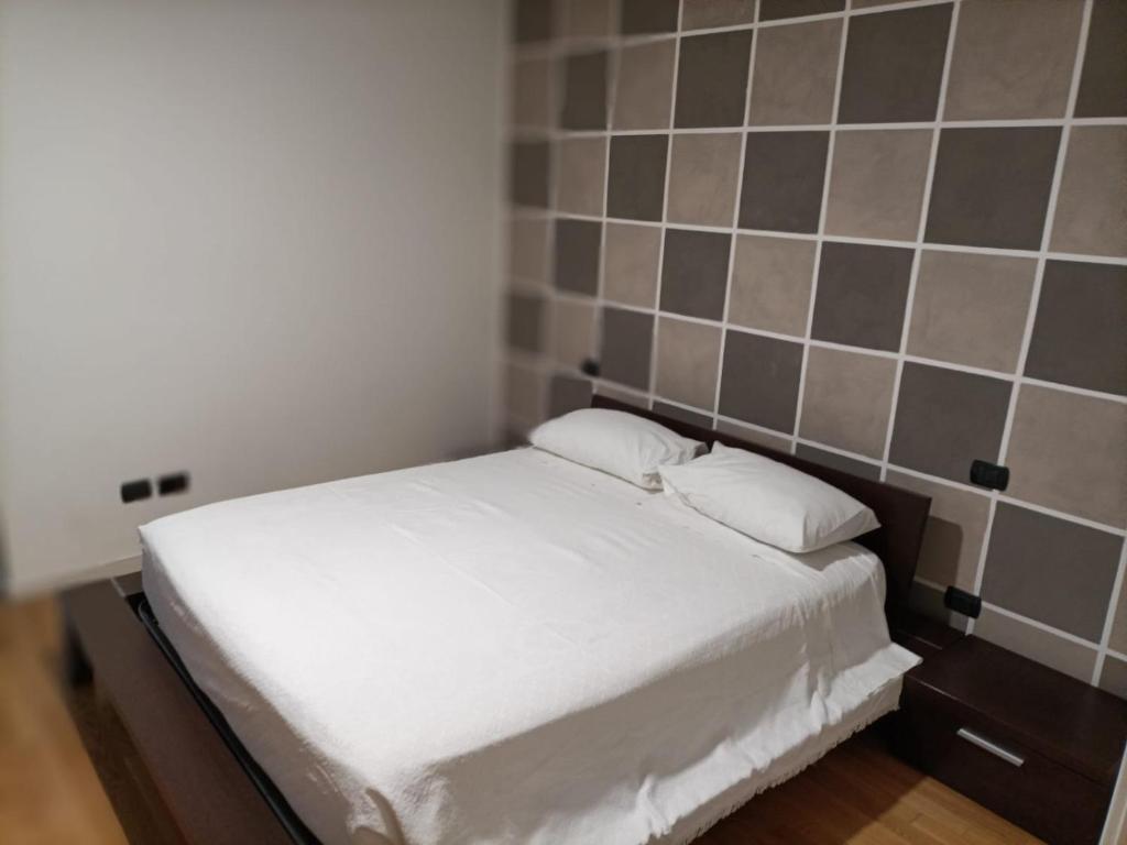 Postel nebo postele na pokoji v ubytování Akihouse by Mauro