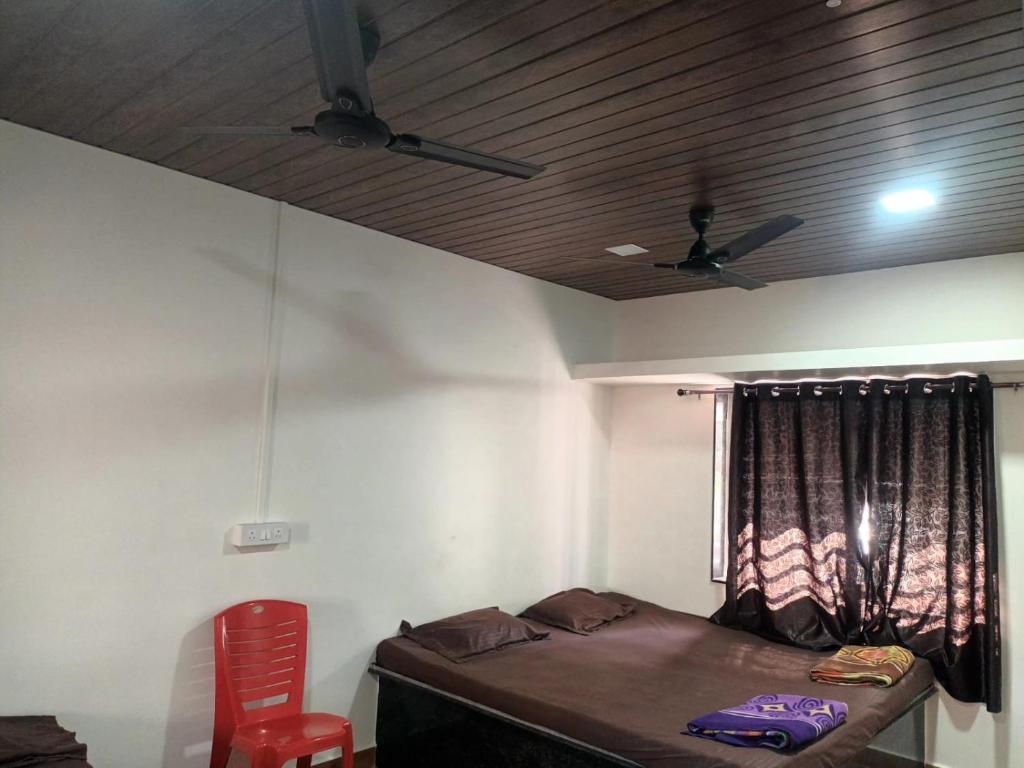 Postel nebo postele na pokoji v ubytování Hemprabha Bed & Breakfast, Ratnagiri
