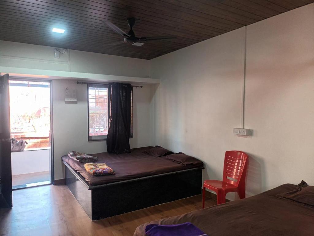 Postel nebo postele na pokoji v ubytování Hemprabha Bed & Breakfast, Ratnagiri