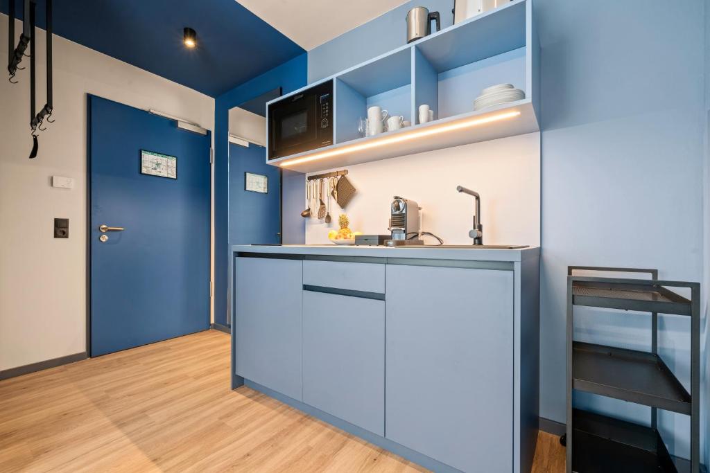 Kuchyň nebo kuchyňský kout v ubytování Motel42-Temporary Living
