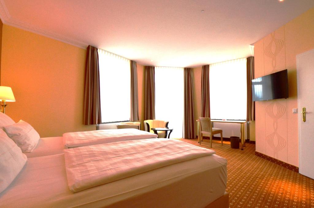 Postel nebo postele na pokoji v ubytování Hotel Mack Private Inn