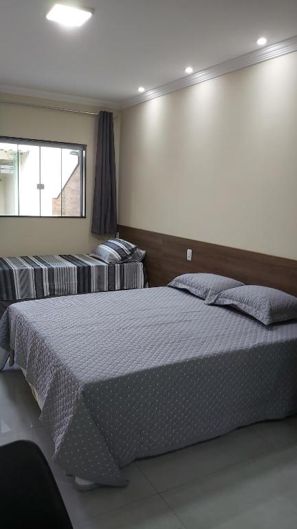 Postel nebo postele na pokoji v ubytování Foguete style - Cabo Frio