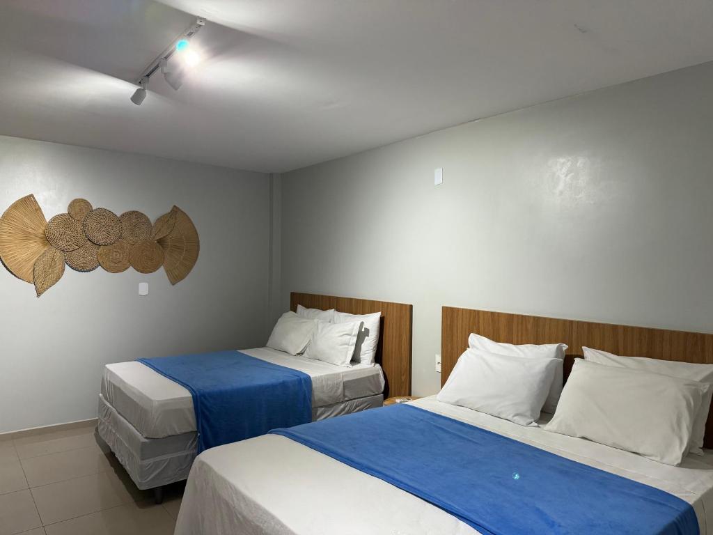 Postel nebo postele na pokoji v ubytování Edifício Creta Hotel