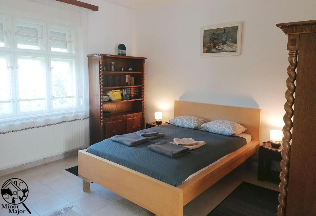 Postel nebo postele na pokoji v ubytování Minor Major Vendégház