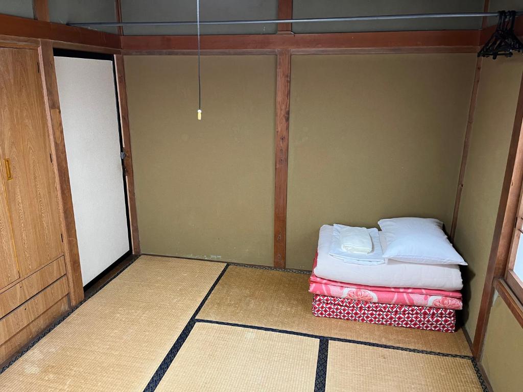 Postel nebo postele na pokoji v ubytování ふる里 Mt Fuji Inn Furusato