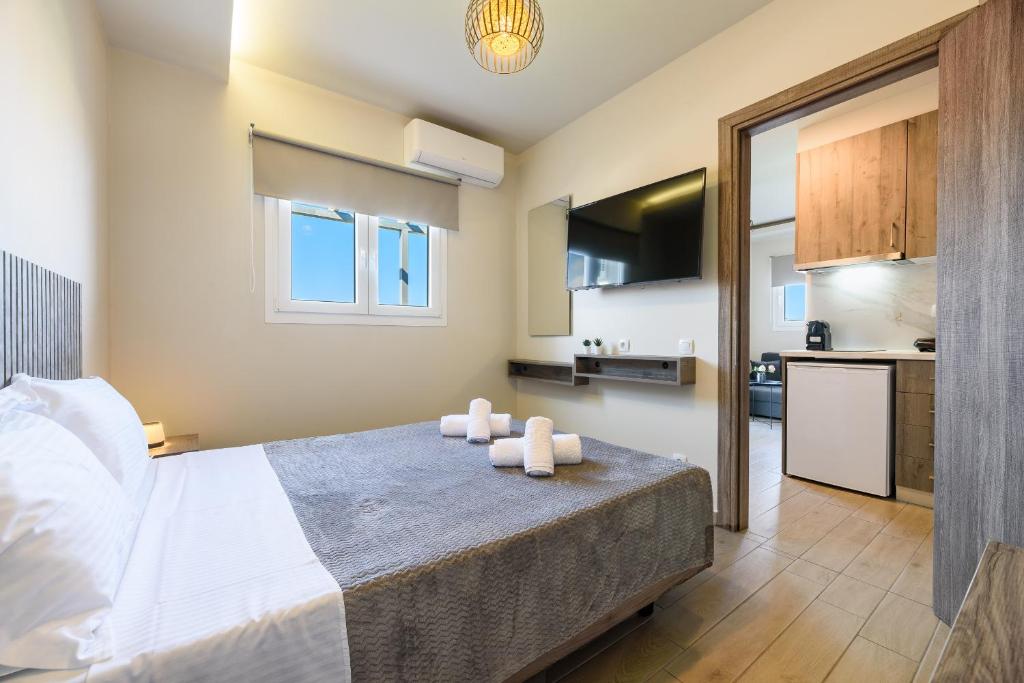 Postel nebo postele na pokoji v ubytování Philippos Residences