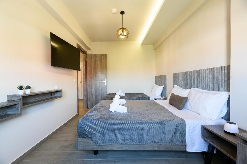 Postel nebo postele na pokoji v ubytování Philippos Residences