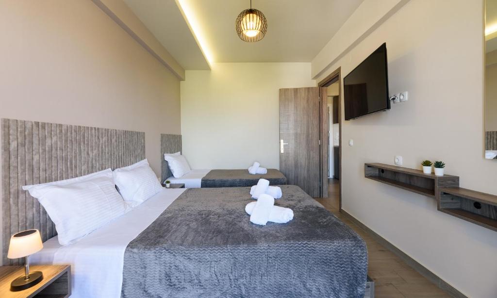 Postel nebo postele na pokoji v ubytování Philippos Residences