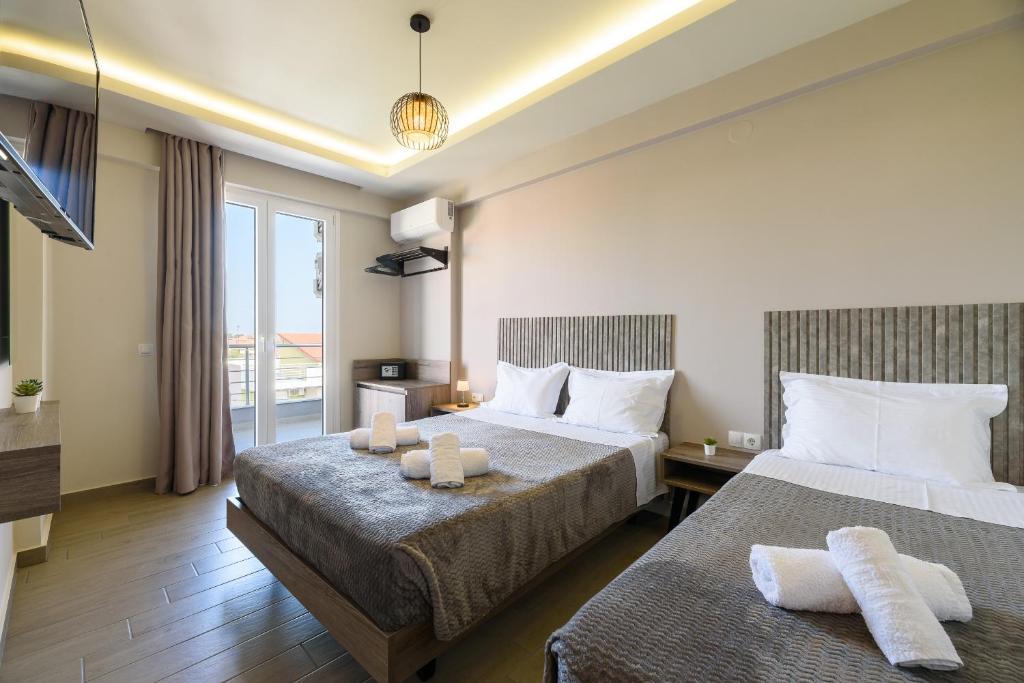 Postel nebo postele na pokoji v ubytování Philippos Residences