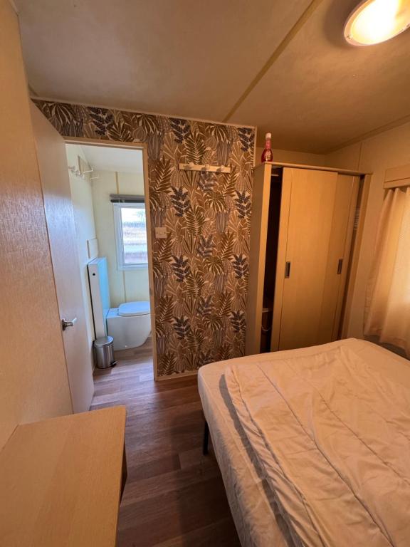 Postel nebo postele na pokoji v ubytování Chez Flo Charmant mobile-home H89