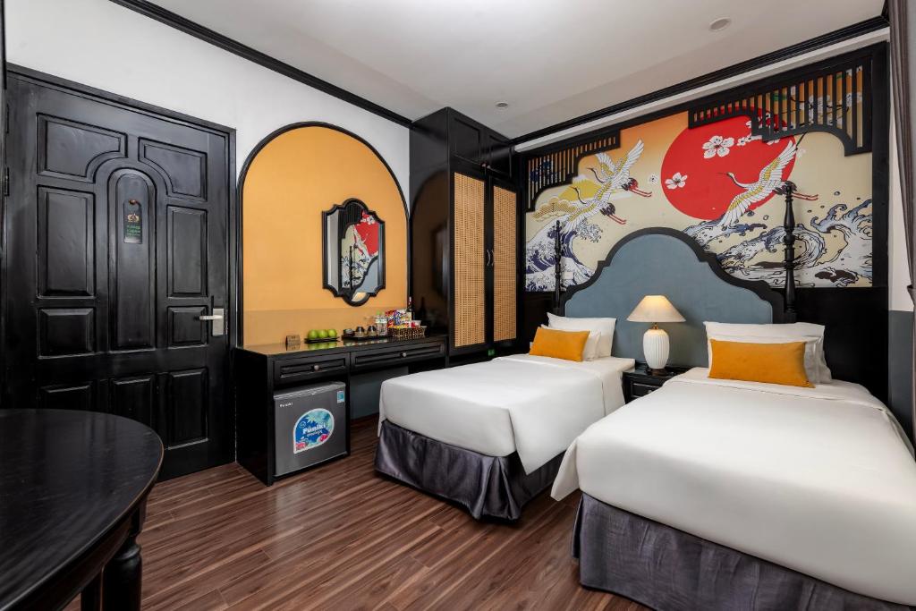 Postel nebo postele na pokoji v ubytování Hanoi Elpis Hotel & Spa