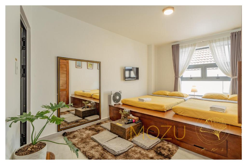 Postel nebo postele na pokoji v ubytování Aki 秋 Hostel