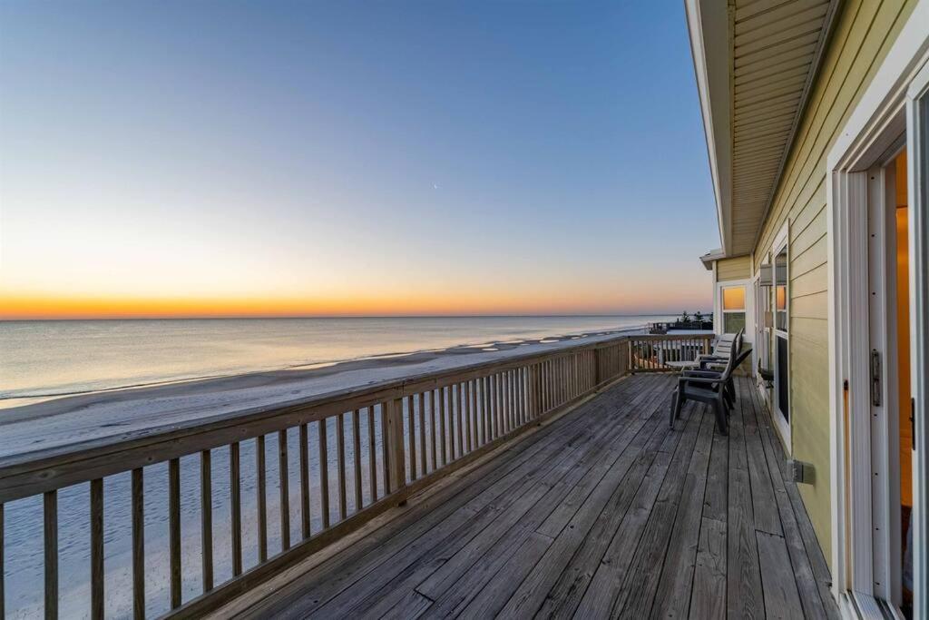 a balcony of a house with a view of the ocean at Beachfront Vilano Retreat in Saint Augustine