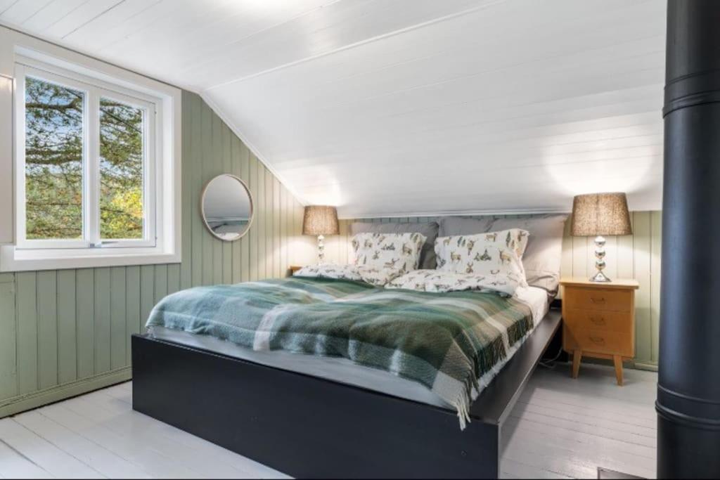 Giường trong phòng chung tại Rindalsskogen cabin
