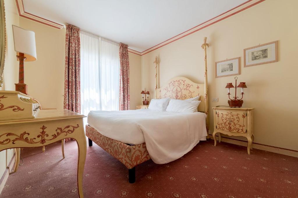 Postel nebo postele na pokoji v ubytování DB Villas Le Ville del Lido Resort